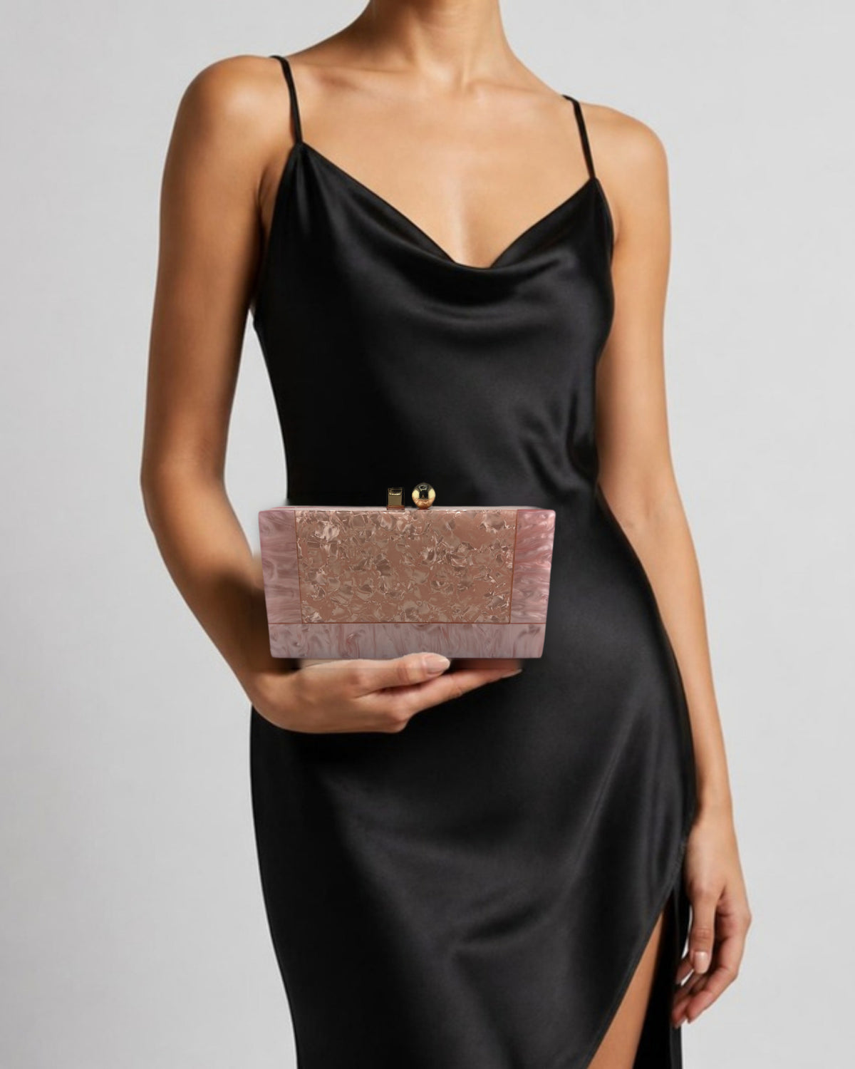 Izoa Brooke Marble Clutch Pink/Pink - held by a model