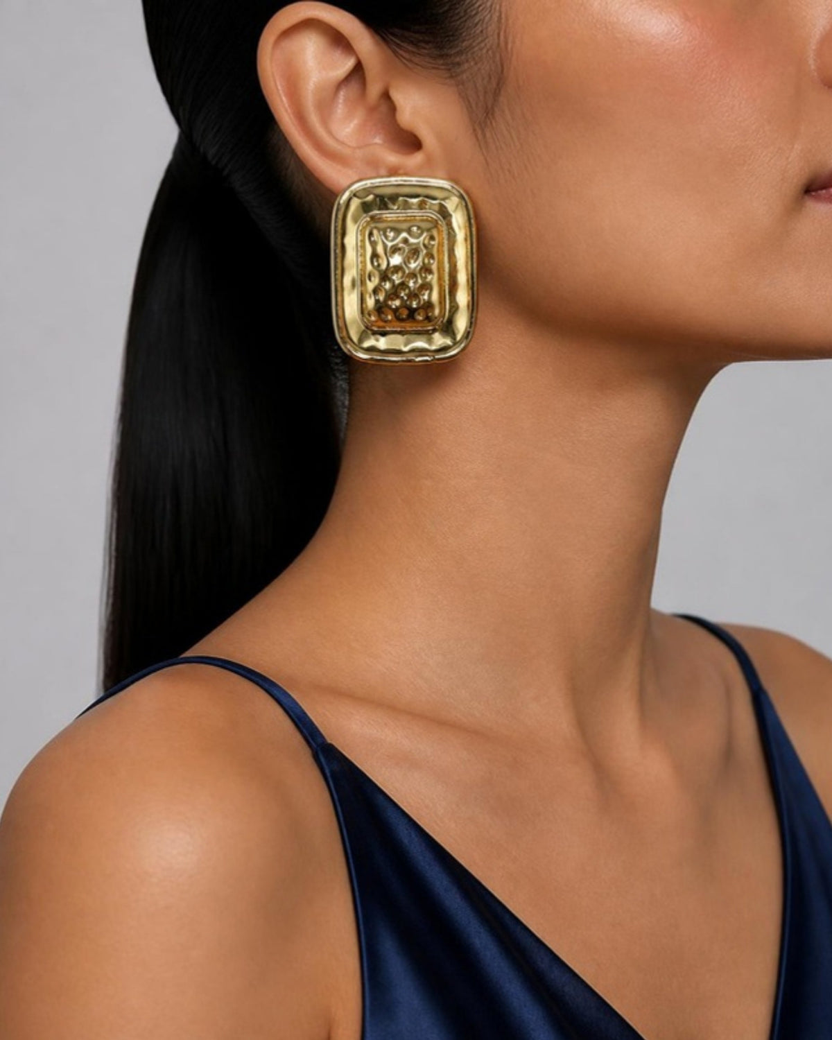 Izoa Araminta Statement Stud Earrings in Gold – worn by a model