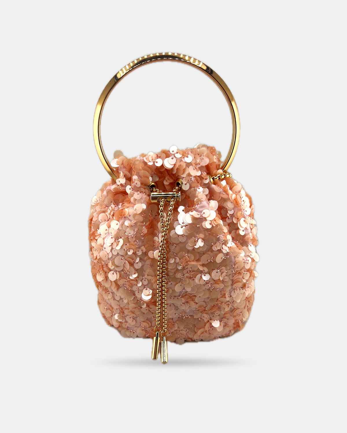 Izoa Aurelia Sequin Bucket Bag in Peach – front view