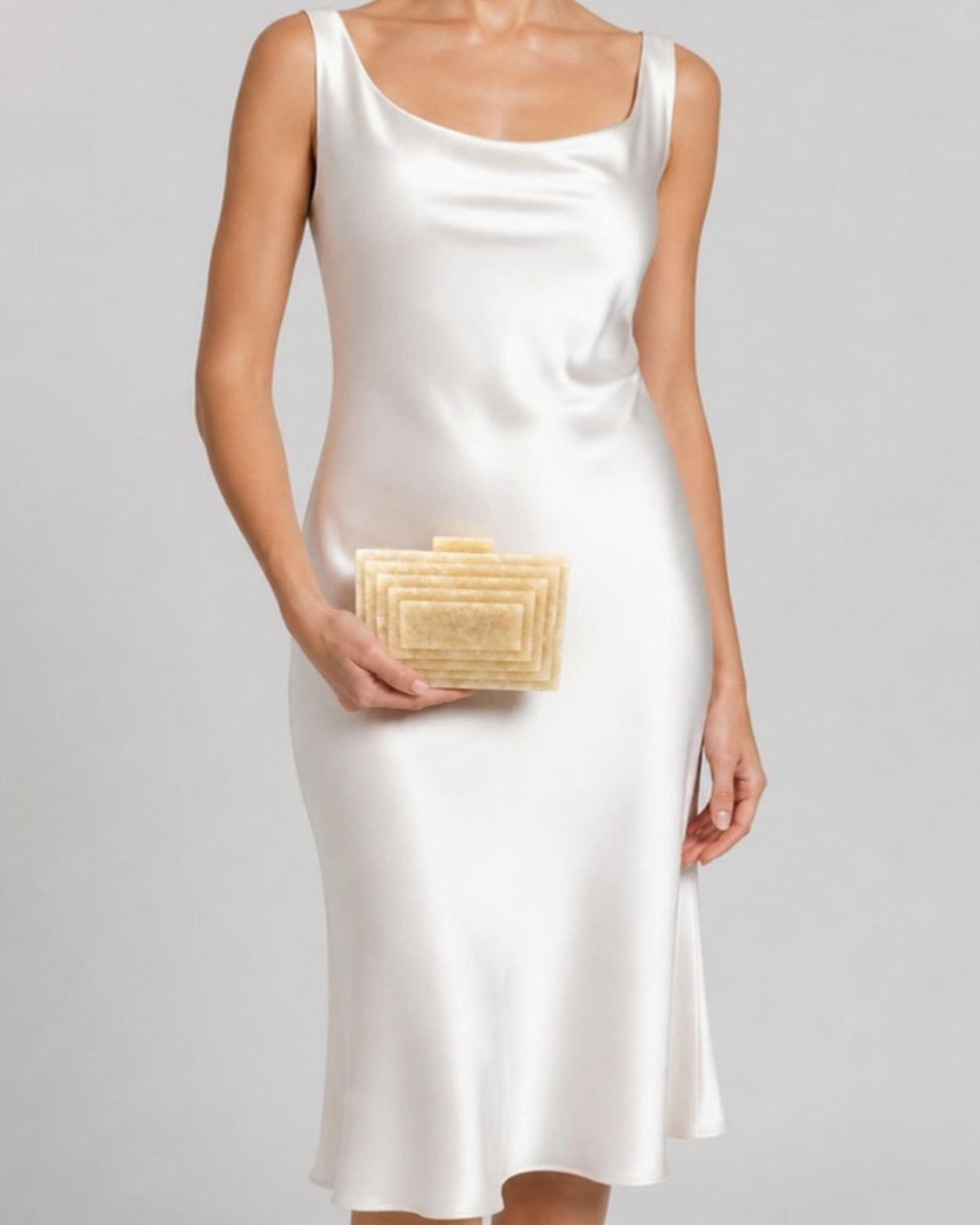 Izoa Imogen Tiered Acrylic Clutch in Peach – worn by a model