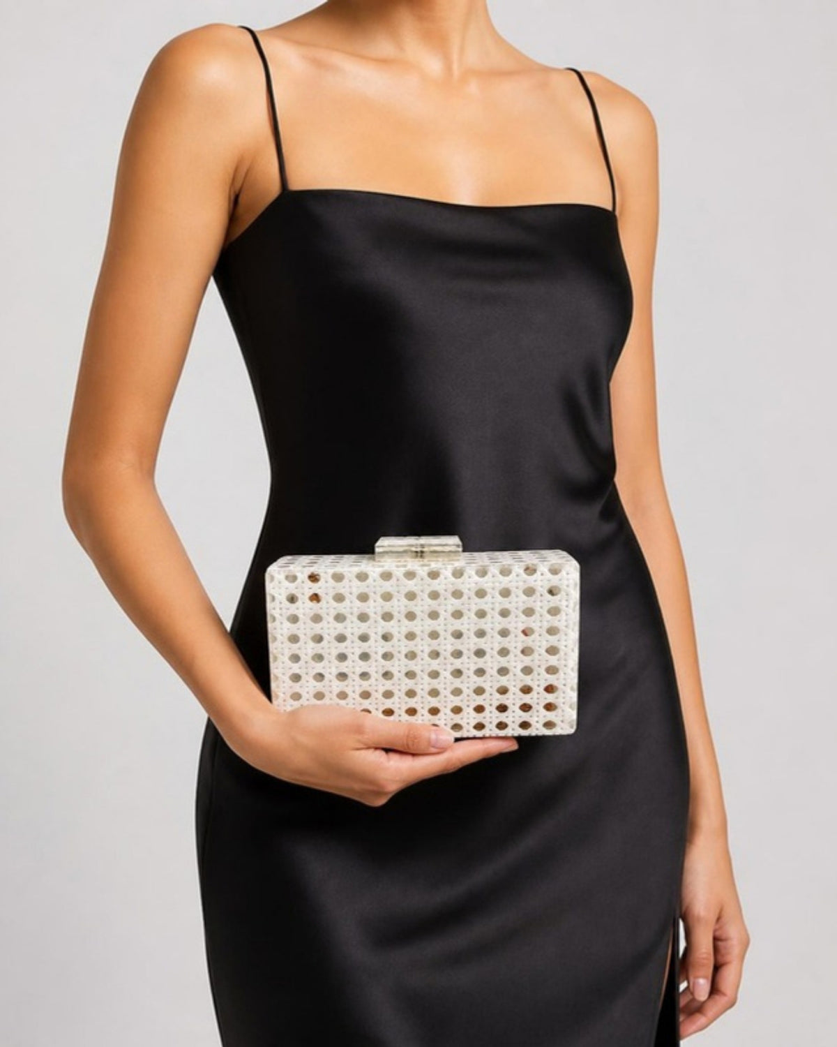 Izoa Juniper Cane Acrylic Clutch in White – worn by a model