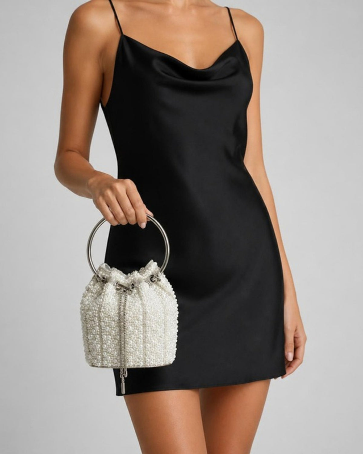 Izoa Perla Pearl Bucket Bag in White – worn by a model