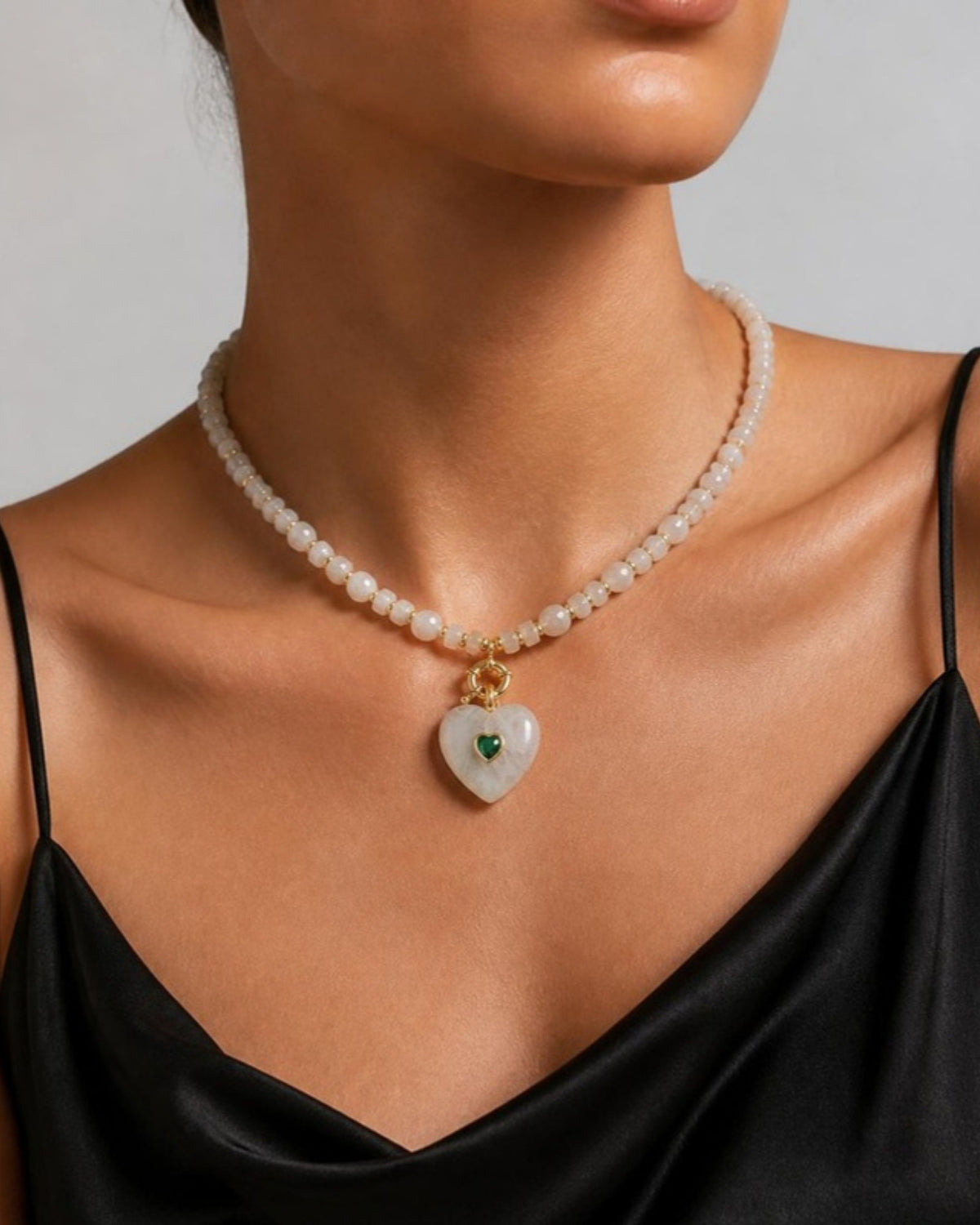 Izoa Rosamund Gemstone Heart Necklace in Clear Quartz – worn by a model