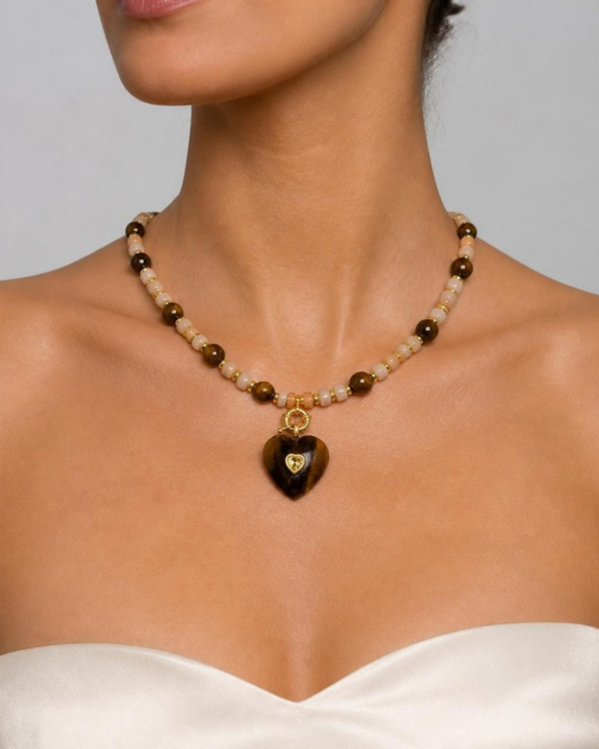 Izoa Rosamund Gemstone Heart Necklace in Tiger's Eye – worn by a model