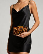 Izoa Zelda Animal Print Clutch in Leopard – worn by a model